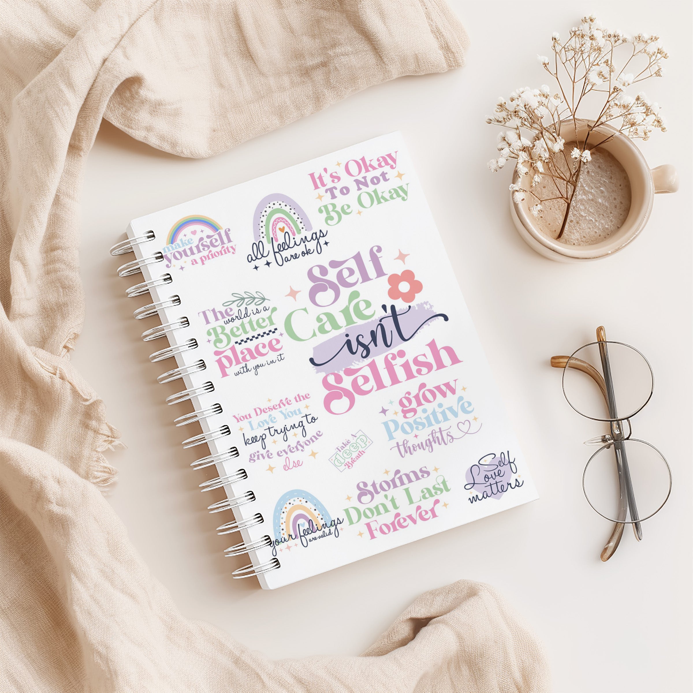 A5 spiral bound 12 week weight loss journal with Pastel Self Care cover design featuring positive mental health quotes and illustrations.
